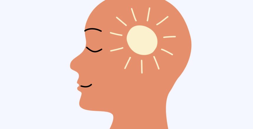 A person having a little glowing sun in his head. Mentally healthy and happy person concept. Human head flat design symbol.